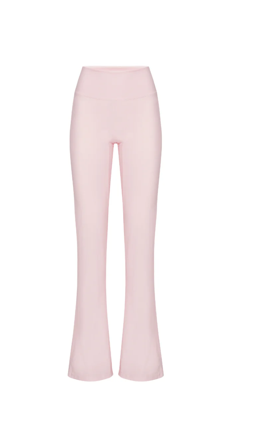 Light pink flared pants on a white background