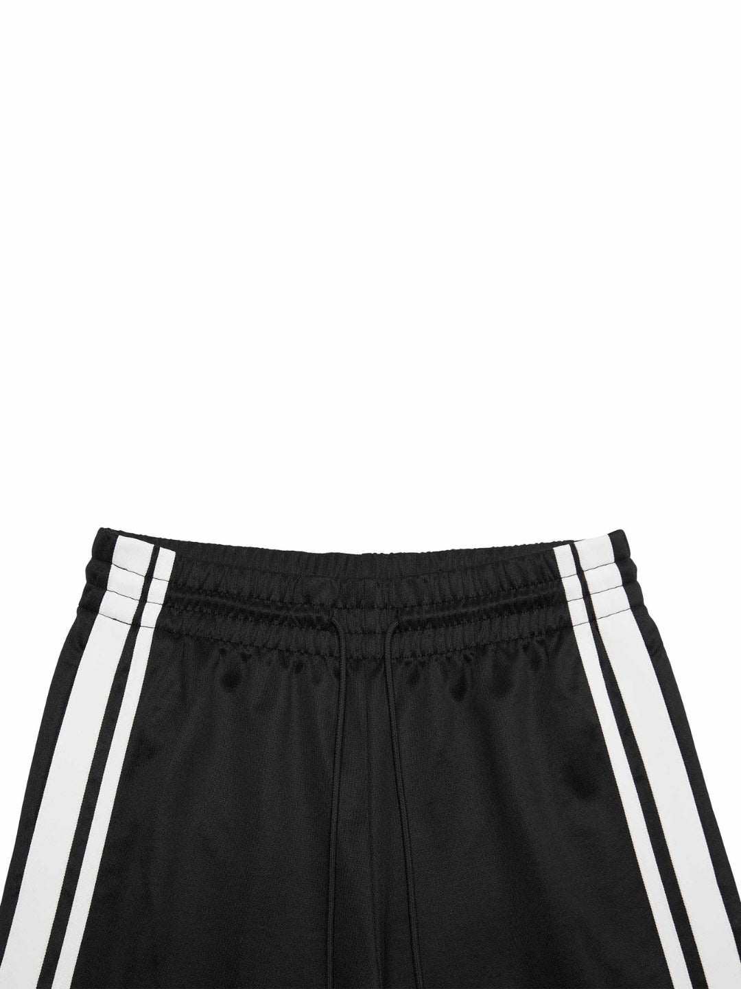 black slit snap button tracks pants with an elastic drawstring waist, featuring white stripes on the legs and a side slit on one leg