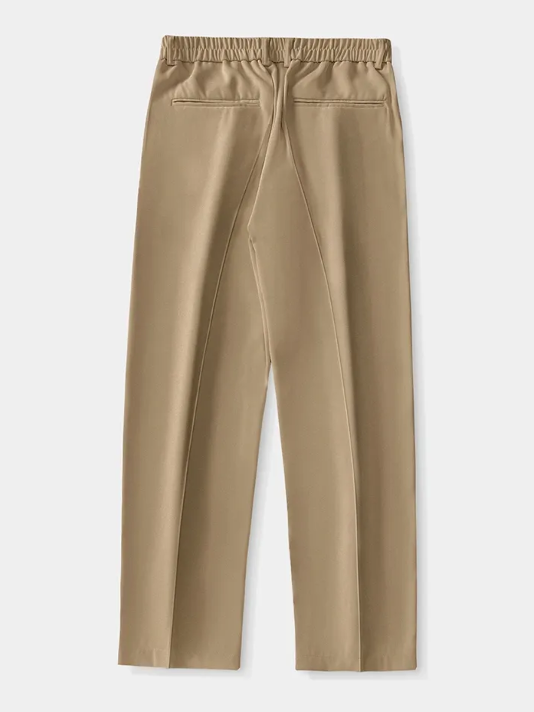 A person wearing brown Tek Air loose fit pants and a white shirt, standing against a white background.