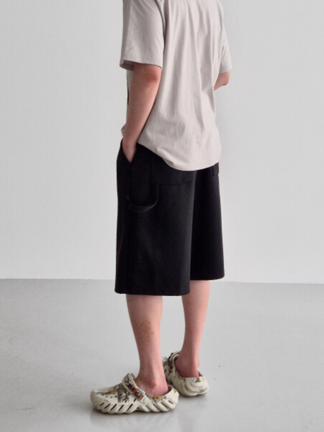 gray carpenter shorts with an elastic waistband and drawstring