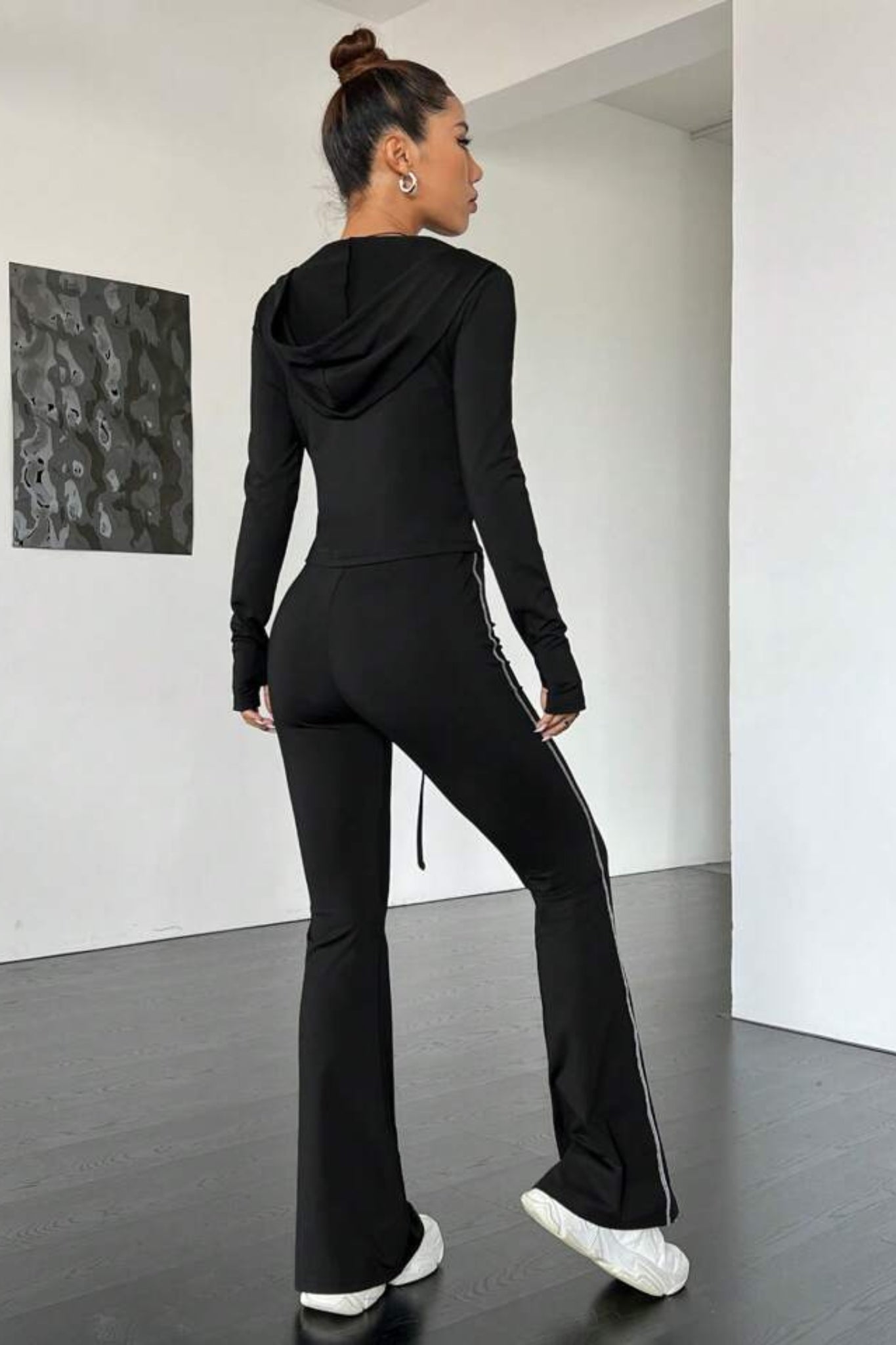 black contrast stitch tracksuit with a zip-up jacket and matching leggings