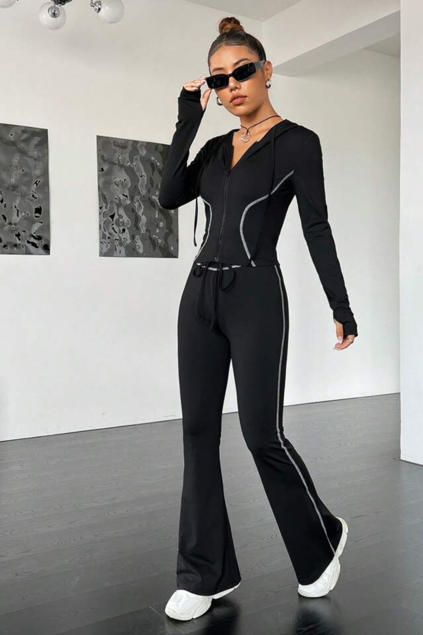 black contrast stitch tracksuit with a zip-up jacket and matching leggings