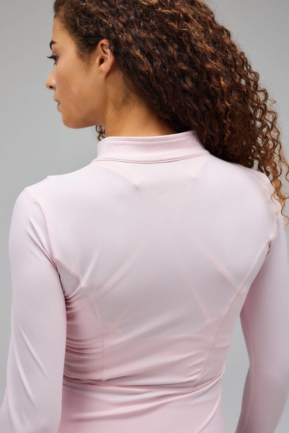 light pink Hyper Zip Jacket with full sleeves, featuring a front zipper and a round neckline.