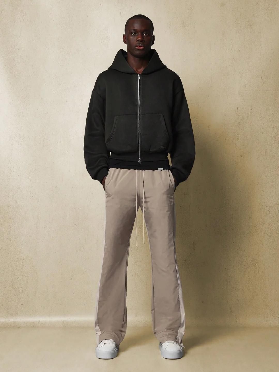 Core Pants, designed with simplicity and comfort in mind. The pants are gray, featuring a sleek and straight fit that accentuates a casual yet chic look.