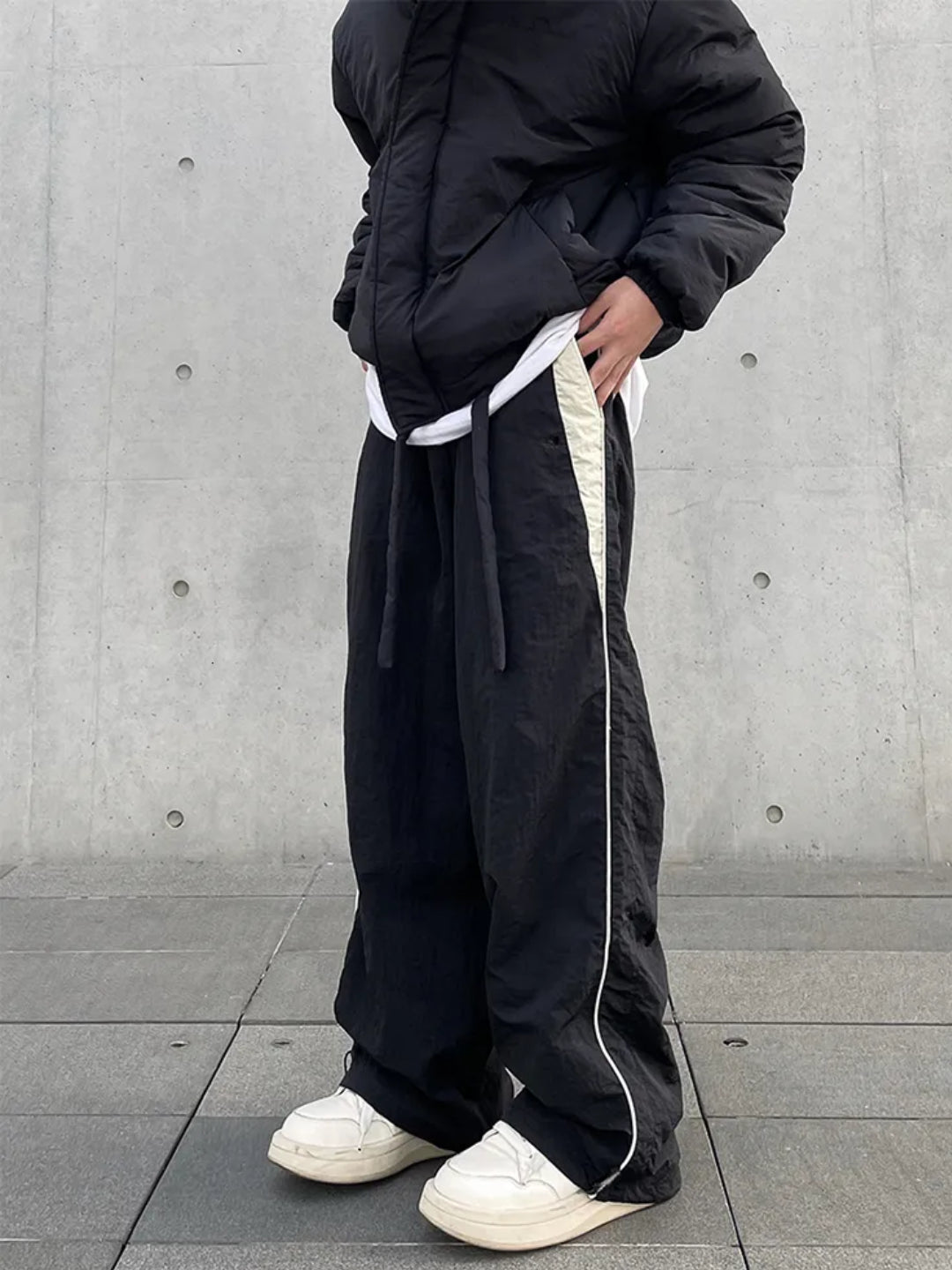 black trackpants with contrast white piping details