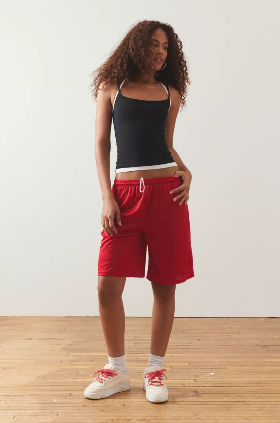 Black layered cami top with thin straps and a white waistband