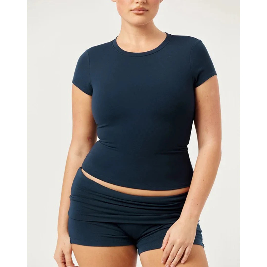 Person wearing a navy blue athletic outfit on a white background