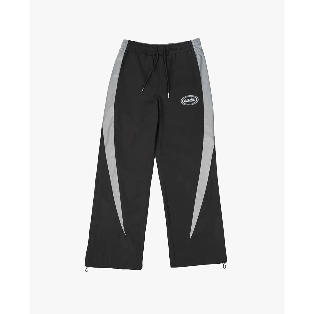 Black track pants with gray stripes on a white background