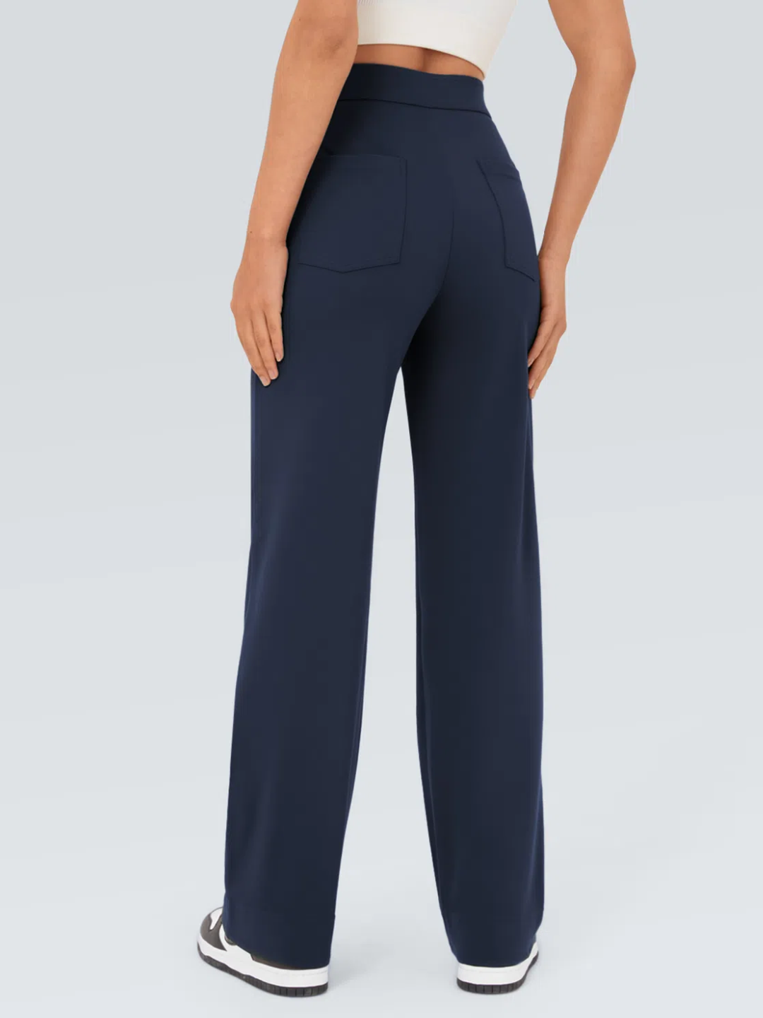 A person wearing high waisted button multiple pockets straight leg casual pants in navy color.