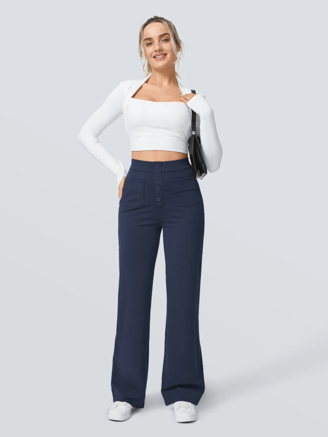 A person wearing high waisted button multiple pockets straight leg casual pants in navy color.