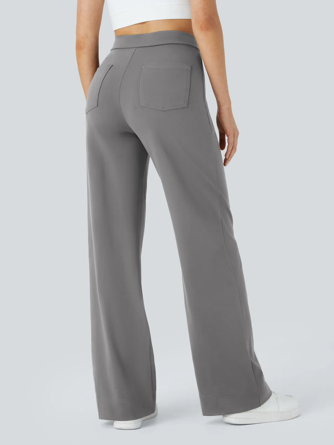 A person wearing high waisted button multiple pockets straight leg casual pants in grey color.