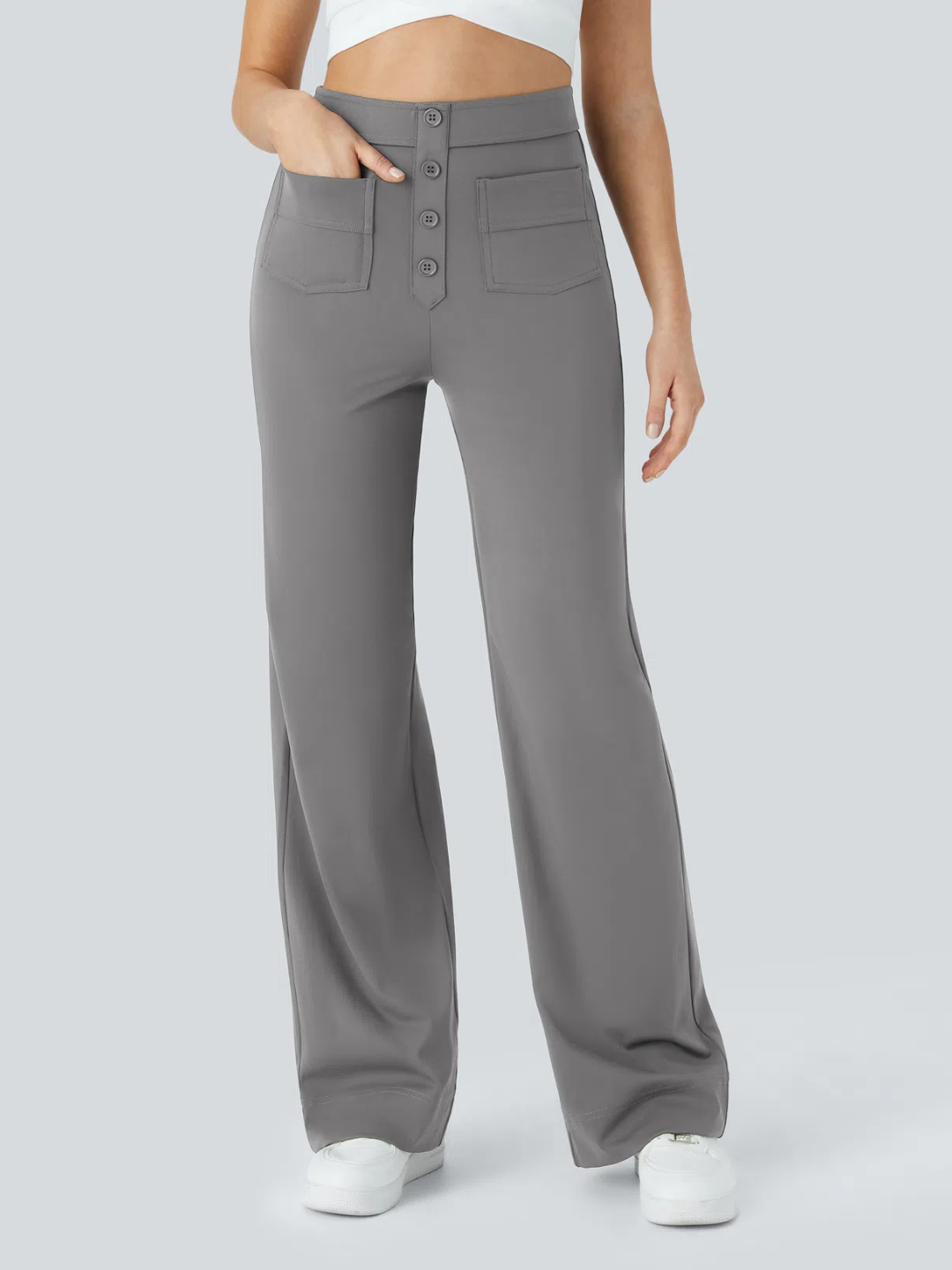 A person wearing high waisted button multiple pockets straight leg casual pants in grey color.
