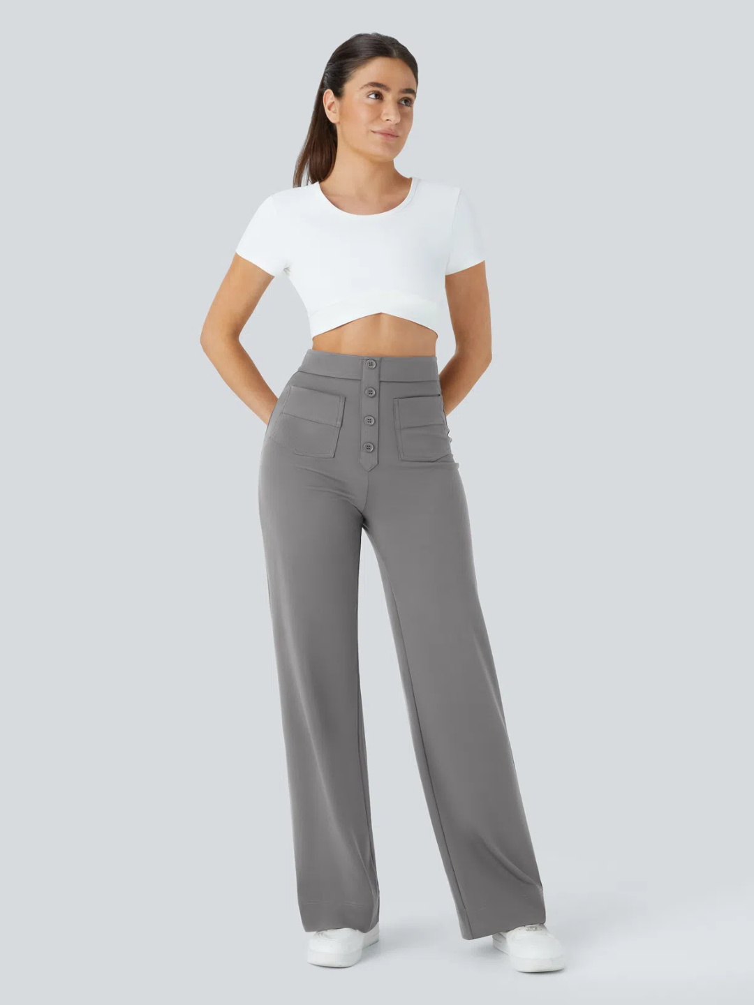A person wearing high waisted button multiple pockets straight leg casual pants in grey color.