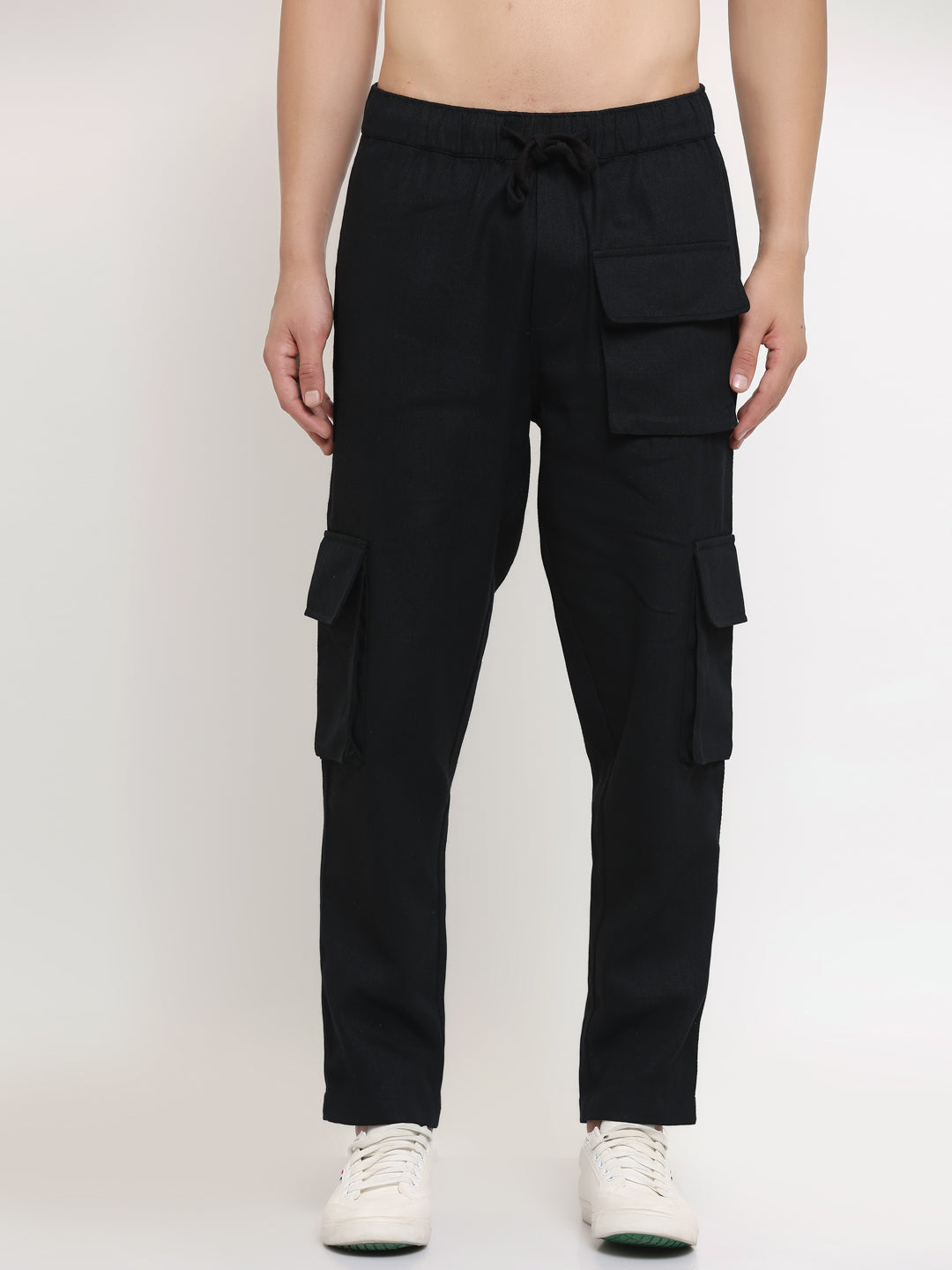 A pair of black slim-fit cargo pants with multiple pockets, featuring an elasticated waistband with a drawstring.