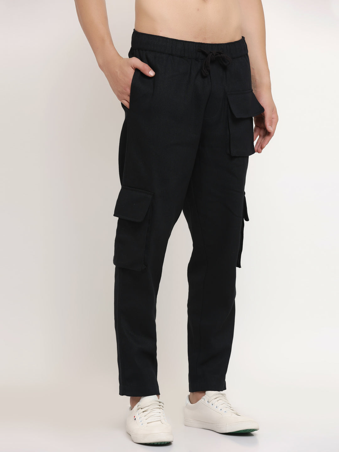 A black slim-fit cargo pants with multiple pockets, featuring an elasticated waistband with a drawstring.