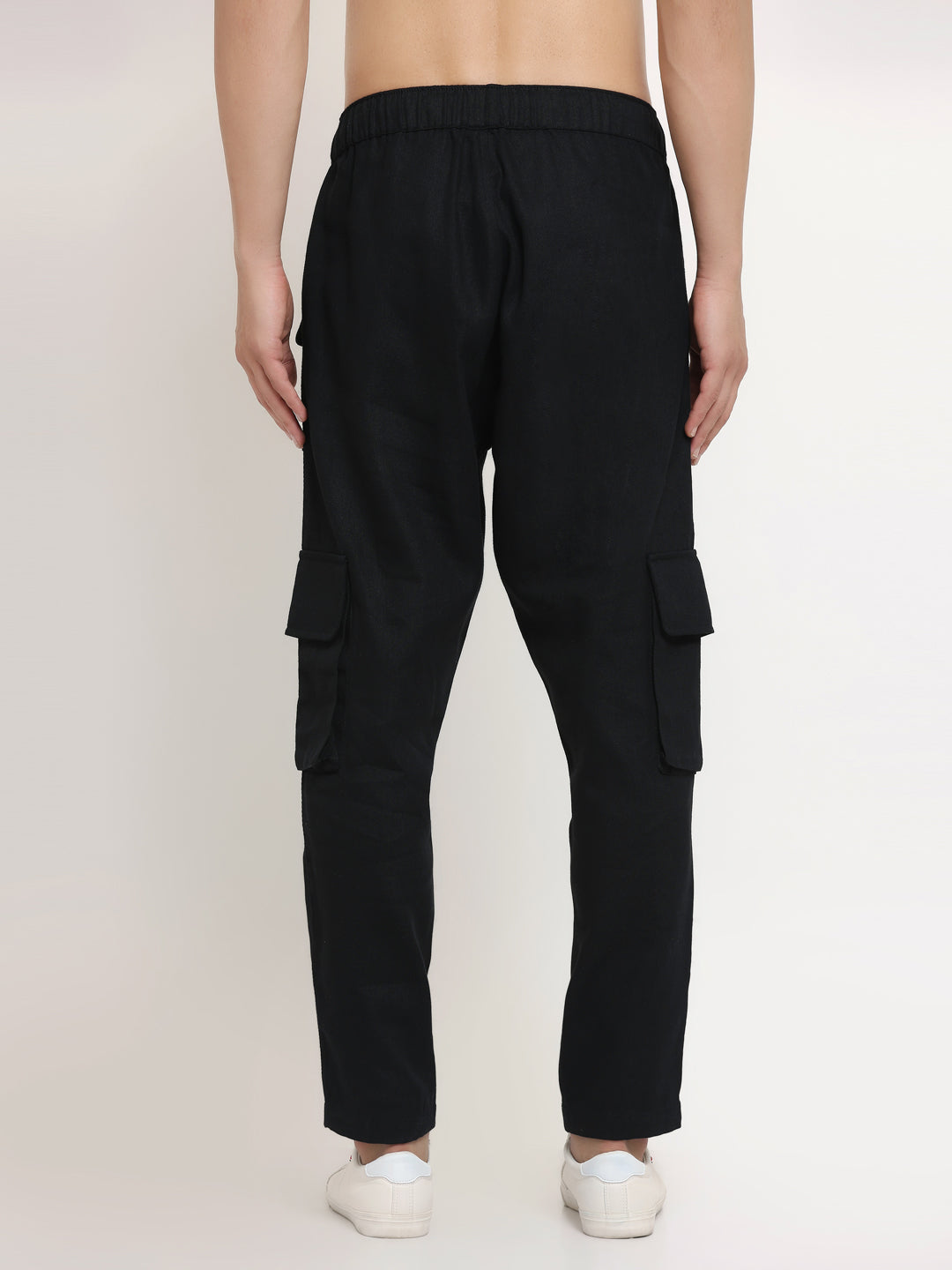 A black slim-fit cargo pants with multiple pockets, featuring an elasticated waistband with a drawstring.