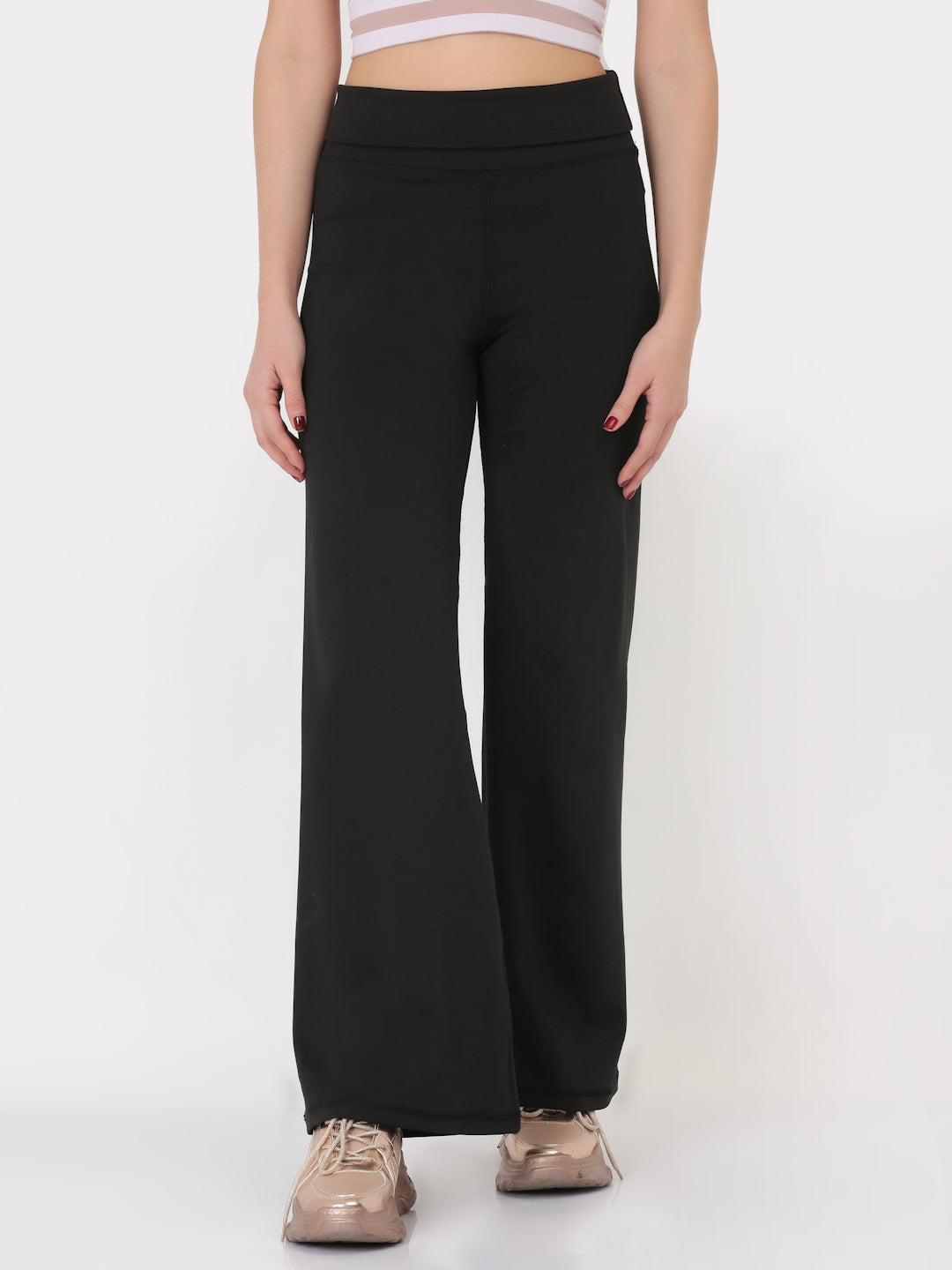 A pair of black ultra flare leggings featuring a foldover waistband, designed for comfort and style.