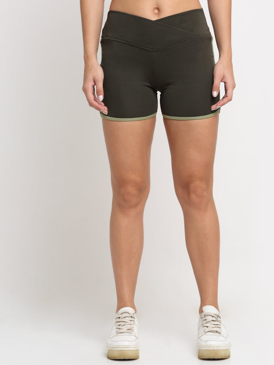 A pair of women's running shorts in deep sage green with contrasting green piping details on the sides.