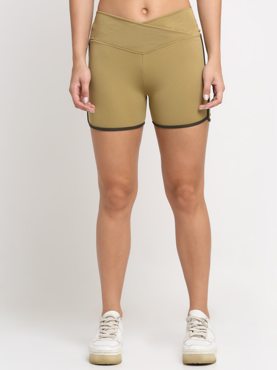 A pair of khaki active running shorts for women with contrasting piping on the sides.