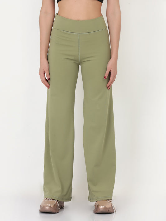 A pair of green flared high-rise full-length yoga pants on a female model.