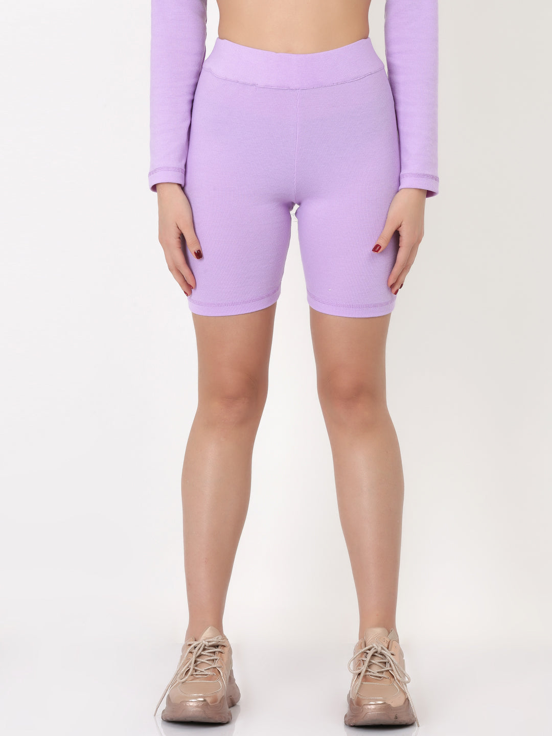 A pair of lavender ribbed biker shorts with a flared leg design, displayed on a female mannequin.