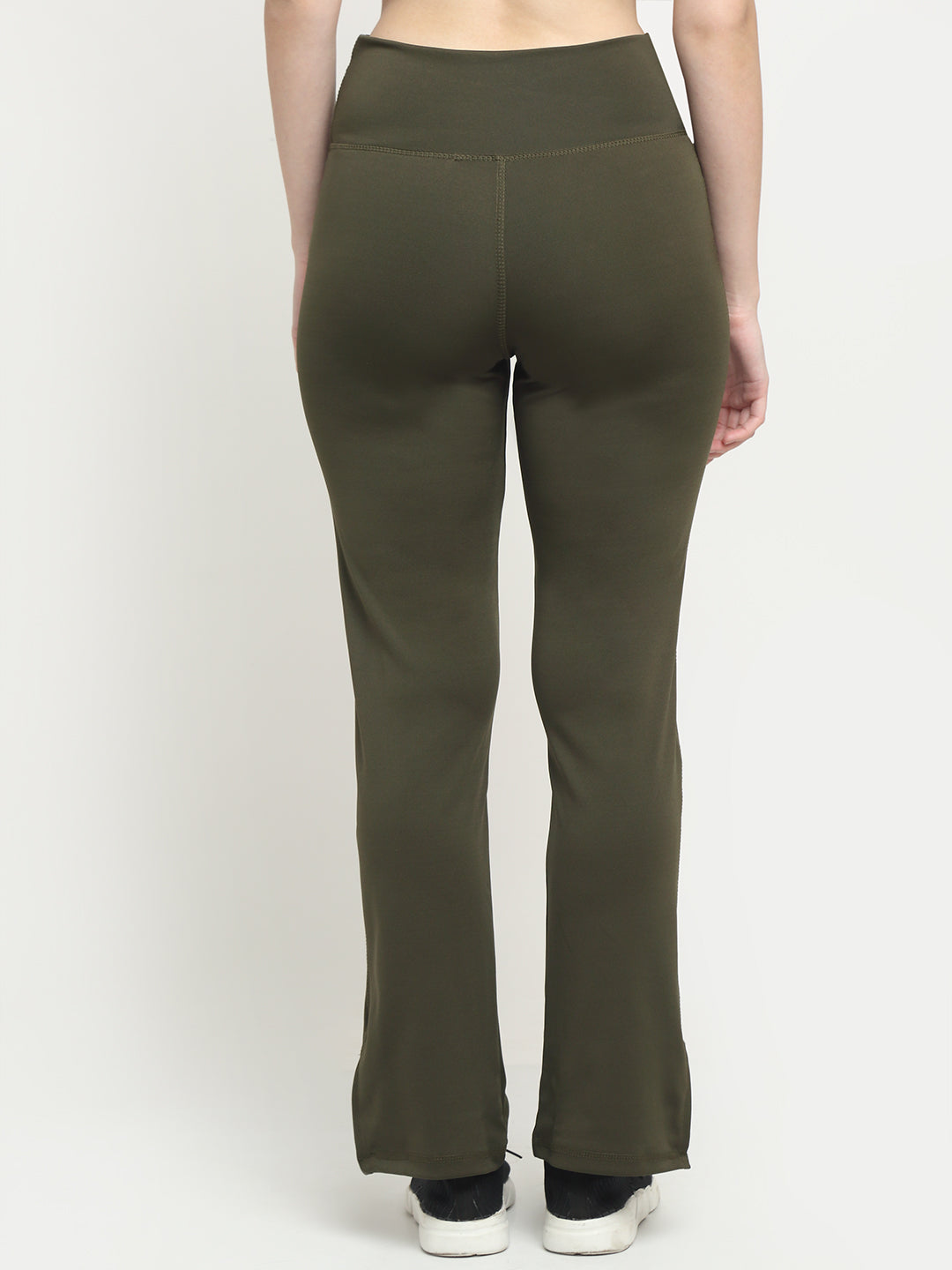 A pair of deep sage green flare leggings with a crossover design and slit hem.