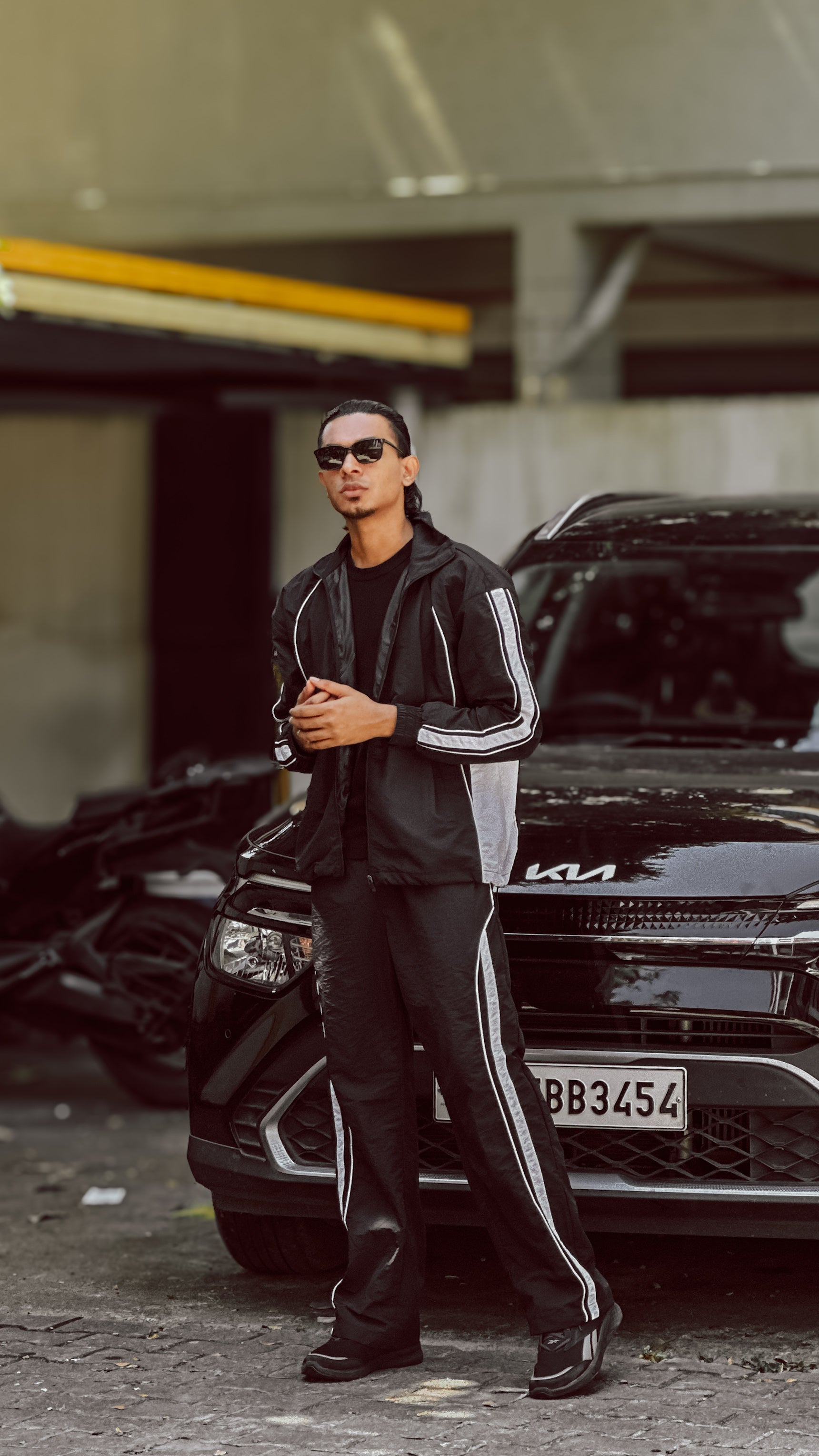 black tracksuit with white stripes