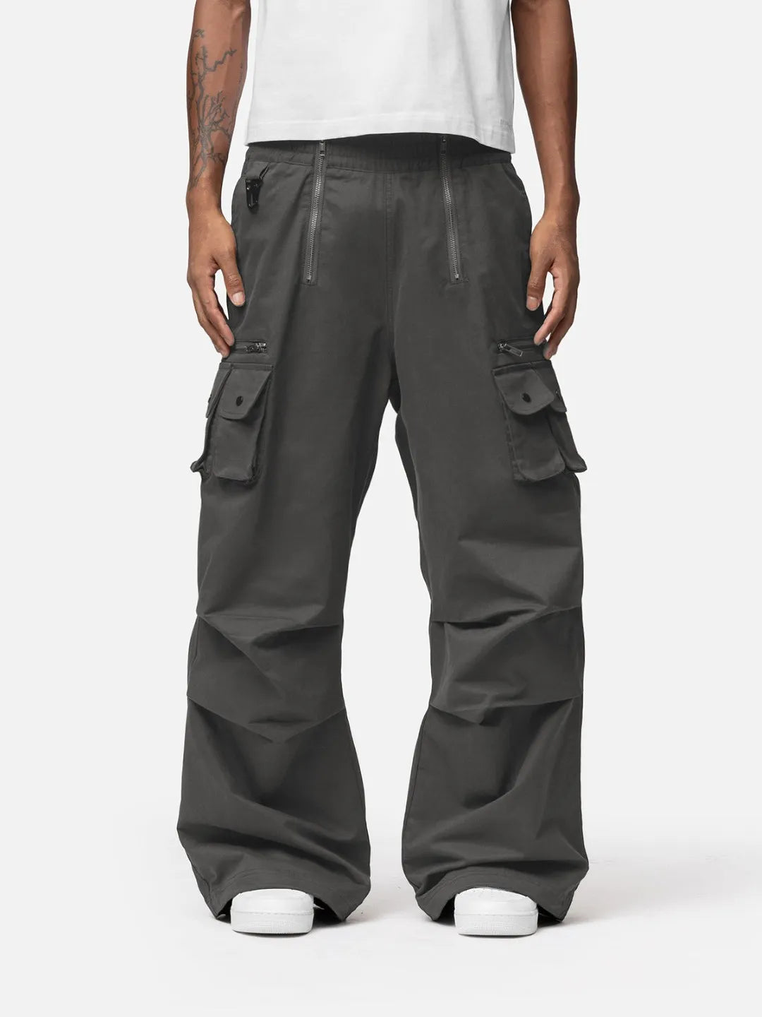Grey cargo pants with adjustable drawstrings and pockets on a white background