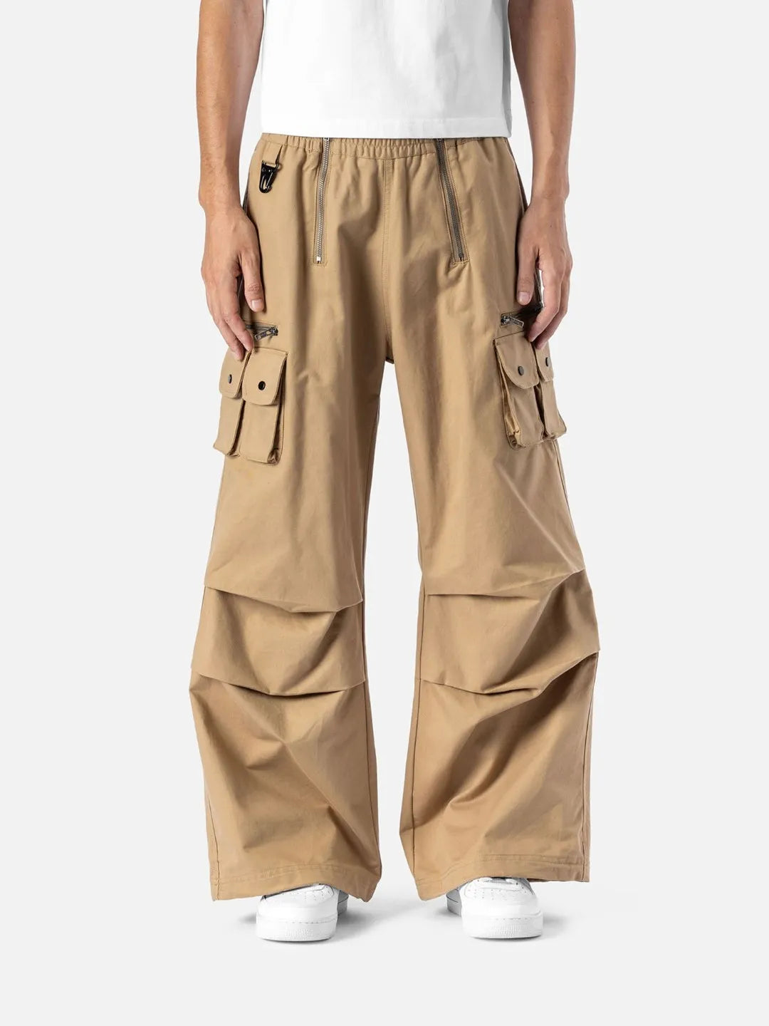 Beige cargo pants with adjustable drawstrings and pockets on a white background