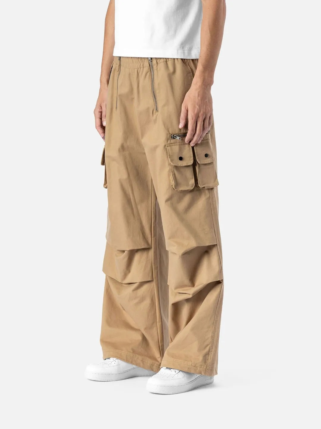 Beige cargo pants with adjustable drawstrings and pockets on a white background