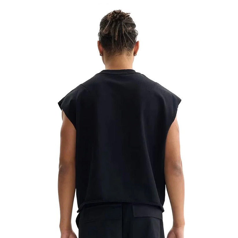 Person wearing a black sleeveless top on a white background