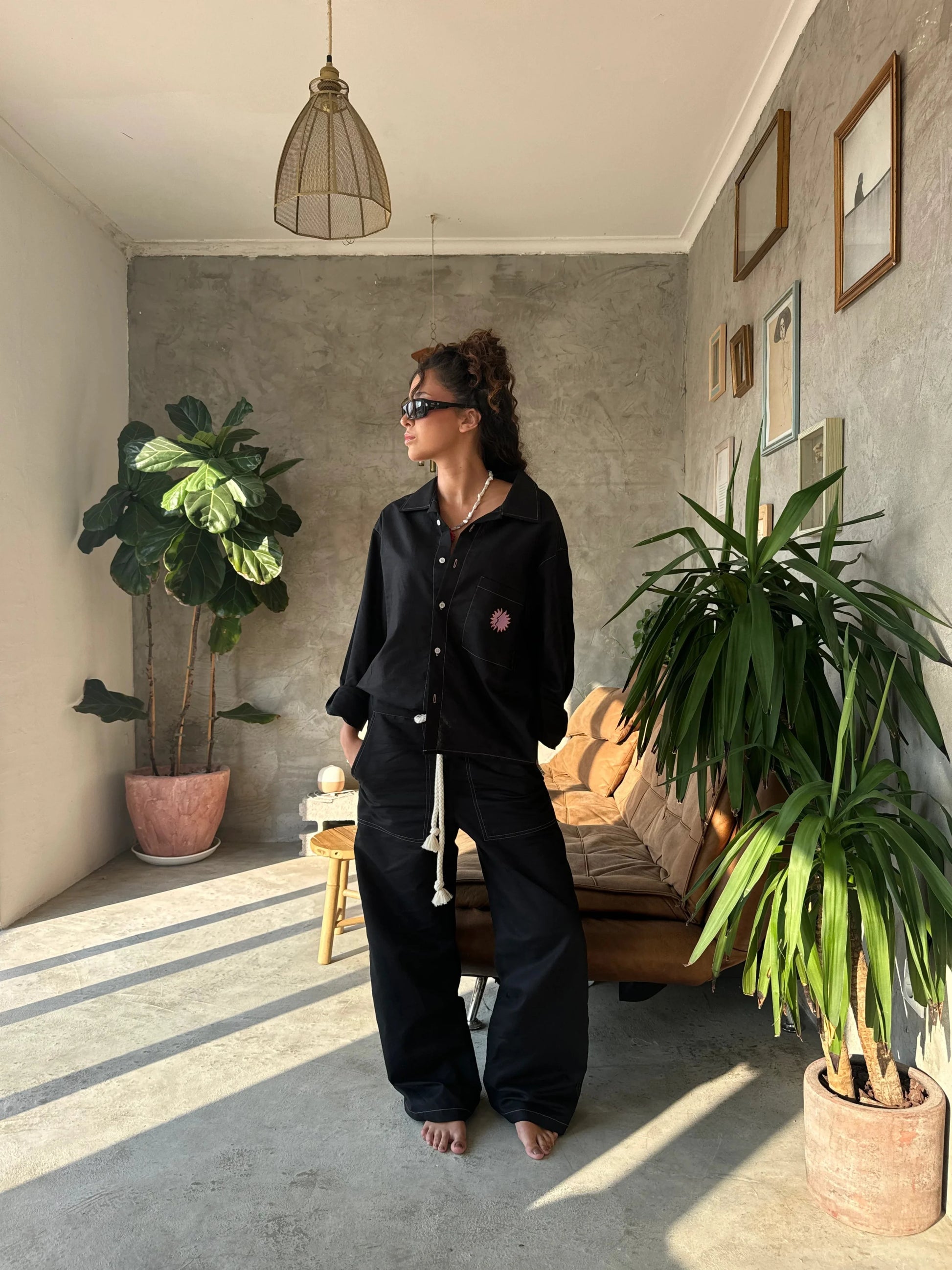 Relaxed fit Sol Linen Pants with a drawstring and pockets available in Dust, Mustard, Black, Indigo, and Pearl colors