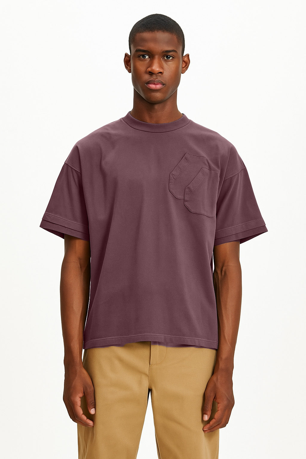 Man wearing a purple t-shirt with a pocket on a white background