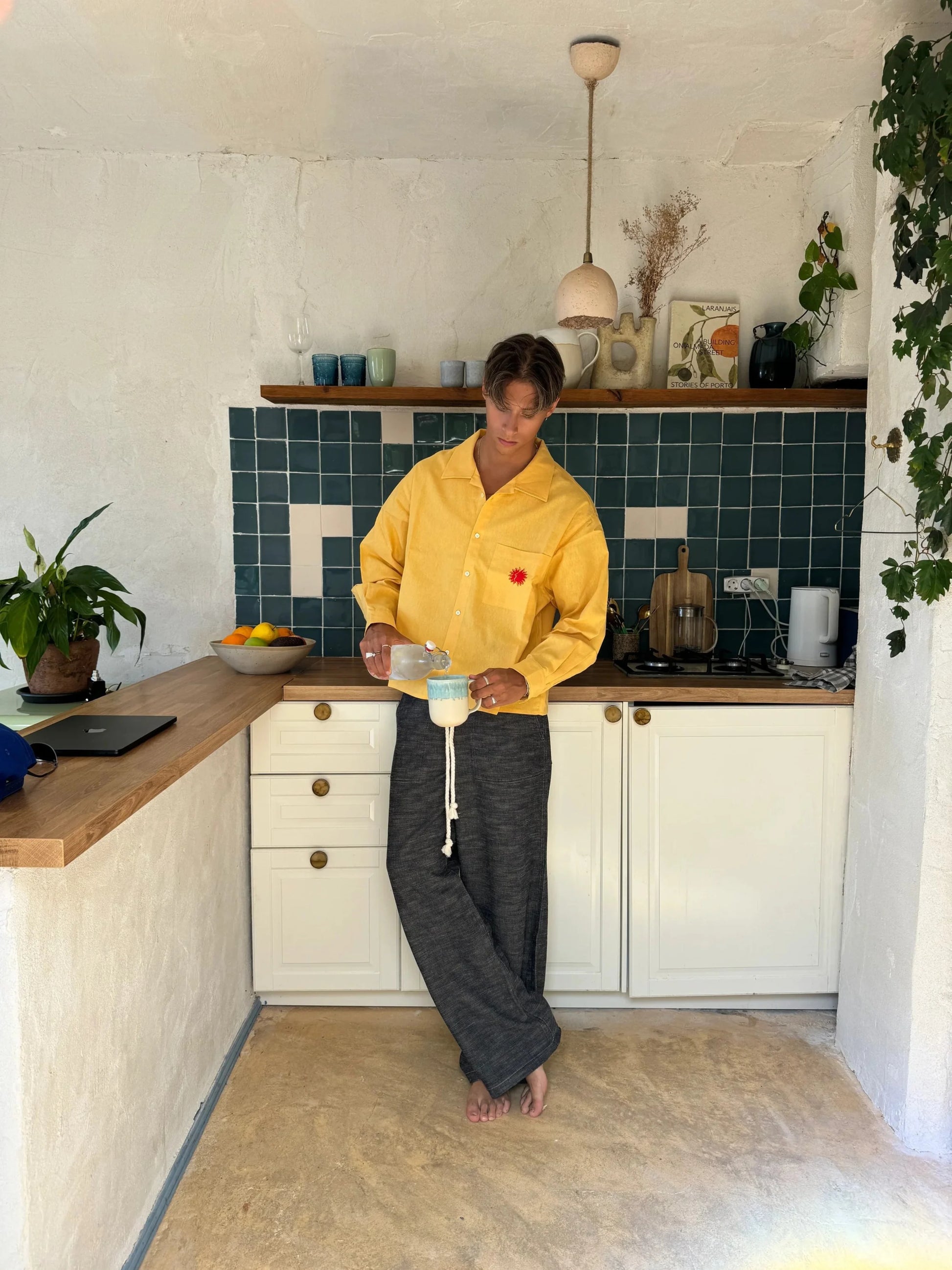 Relaxed fit Sol Linen Pants with a drawstring and pockets available in Dust, Mustard, Black, Indigo, and Pearl colors