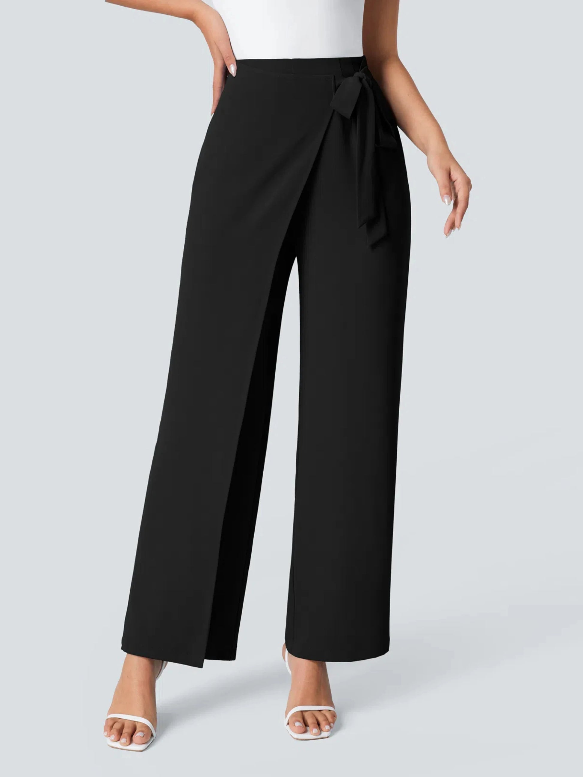 Black wide-leg pants with a tie detail on a light gray background