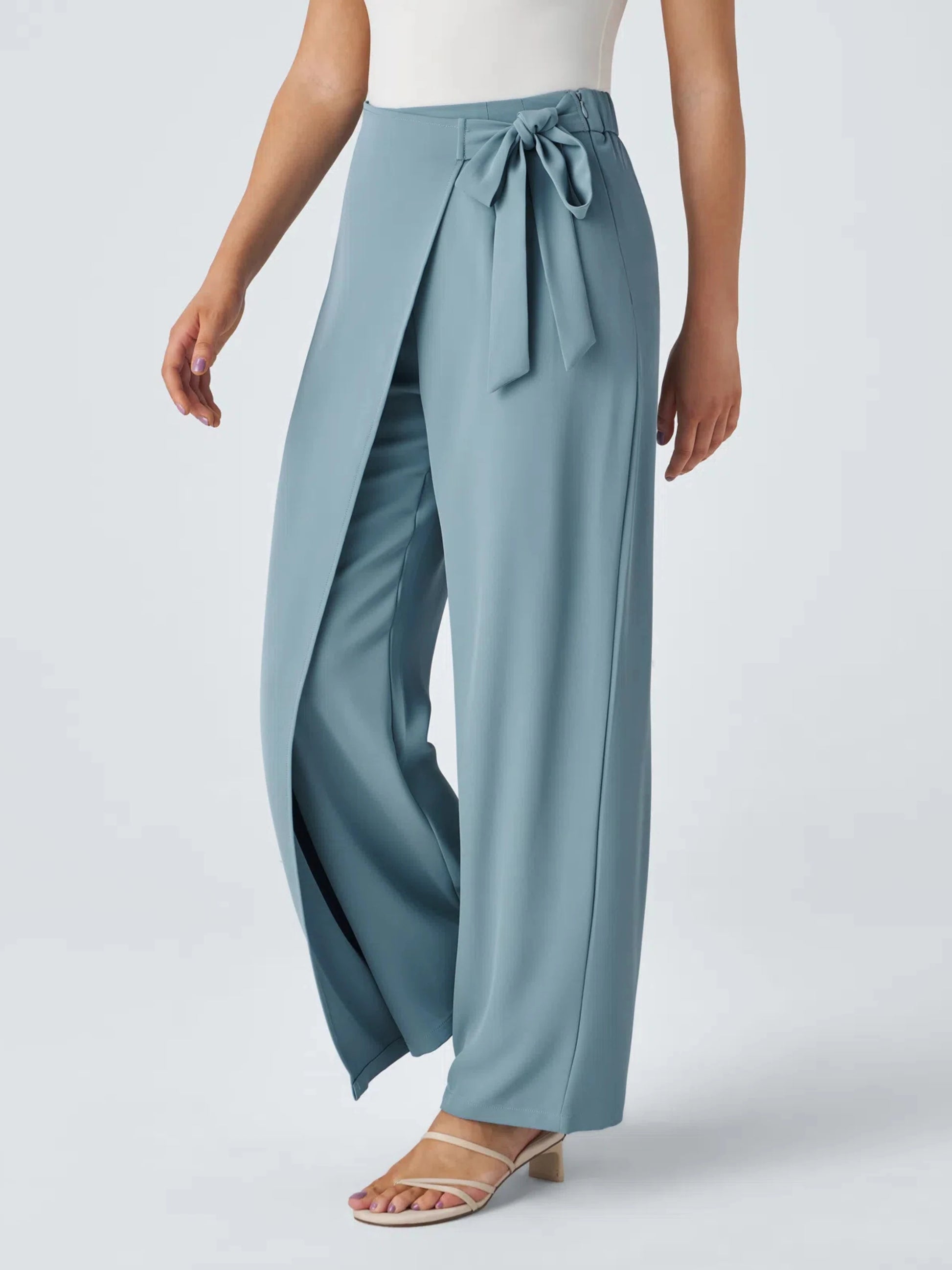 Teal wide-leg pants with a tie waist on a white background