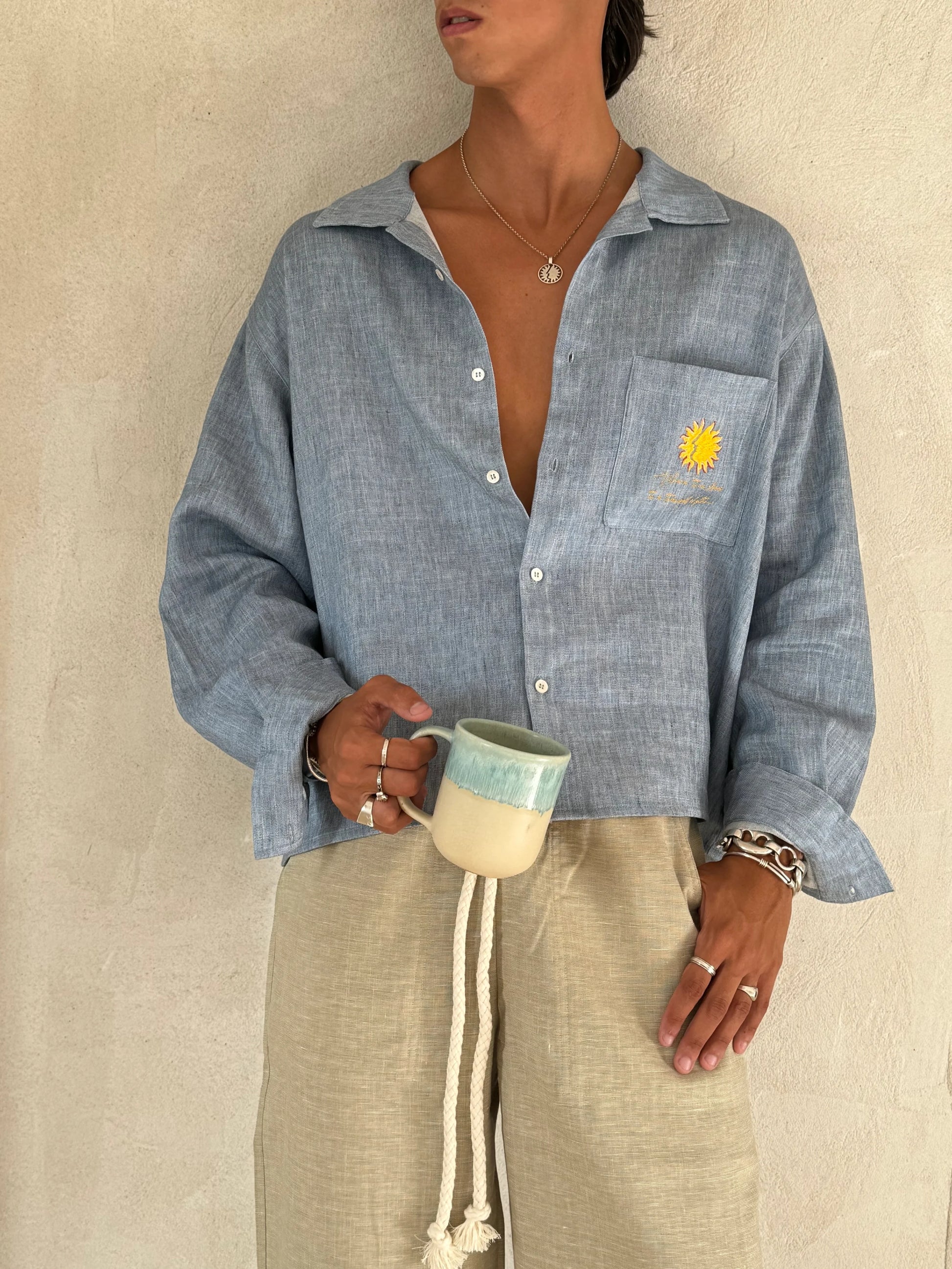 Relaxed fit Sol Linen Pants with a drawstring and pockets available in Dust, Mustard, Black, Indigo, and Pearl colors
