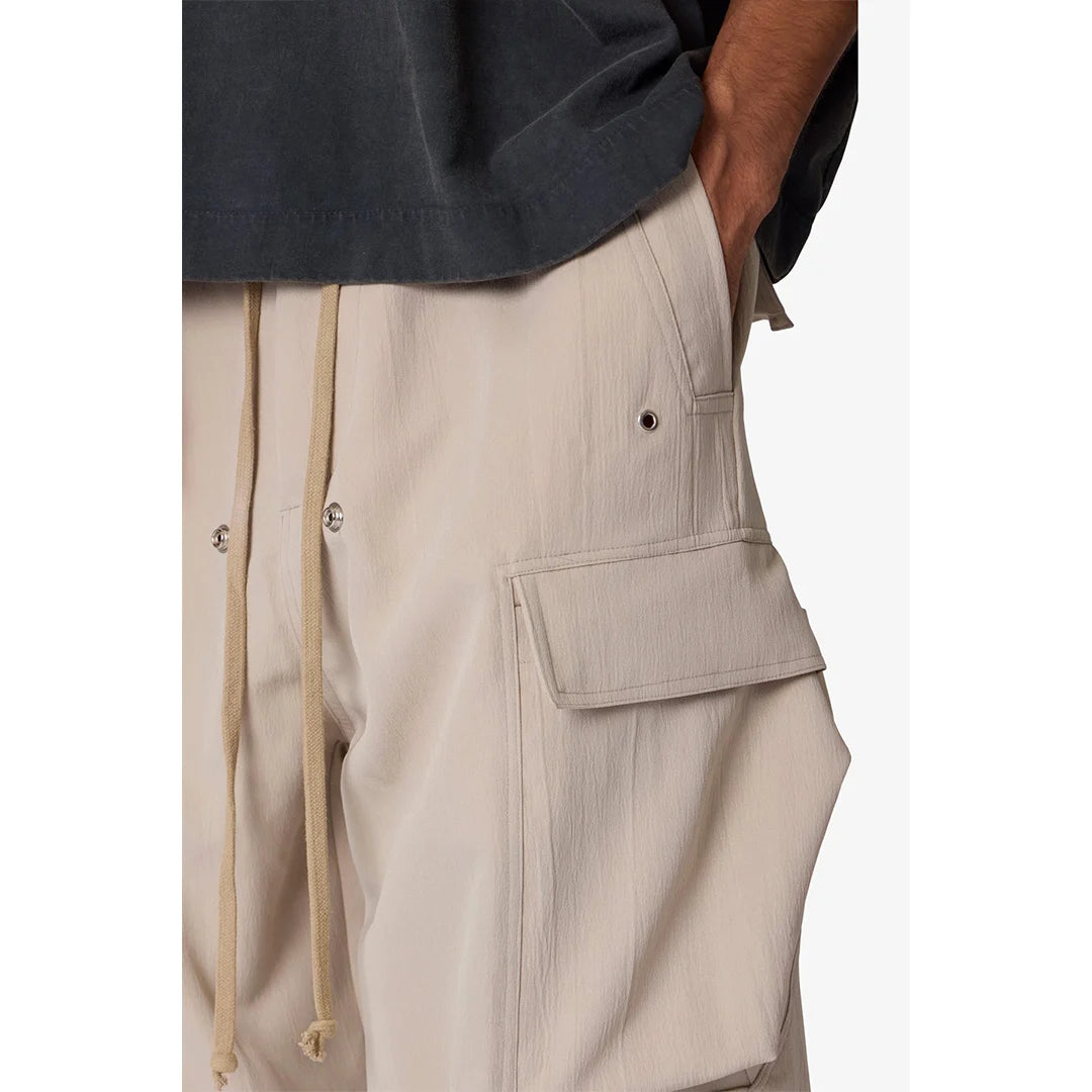Beige cargo shorts with a plain background