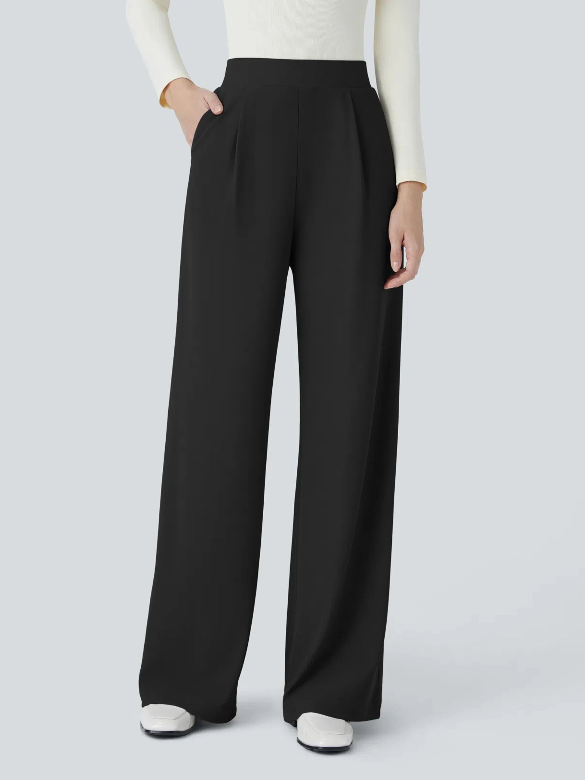 Black wide-leg pants worn by a person on a light gray background