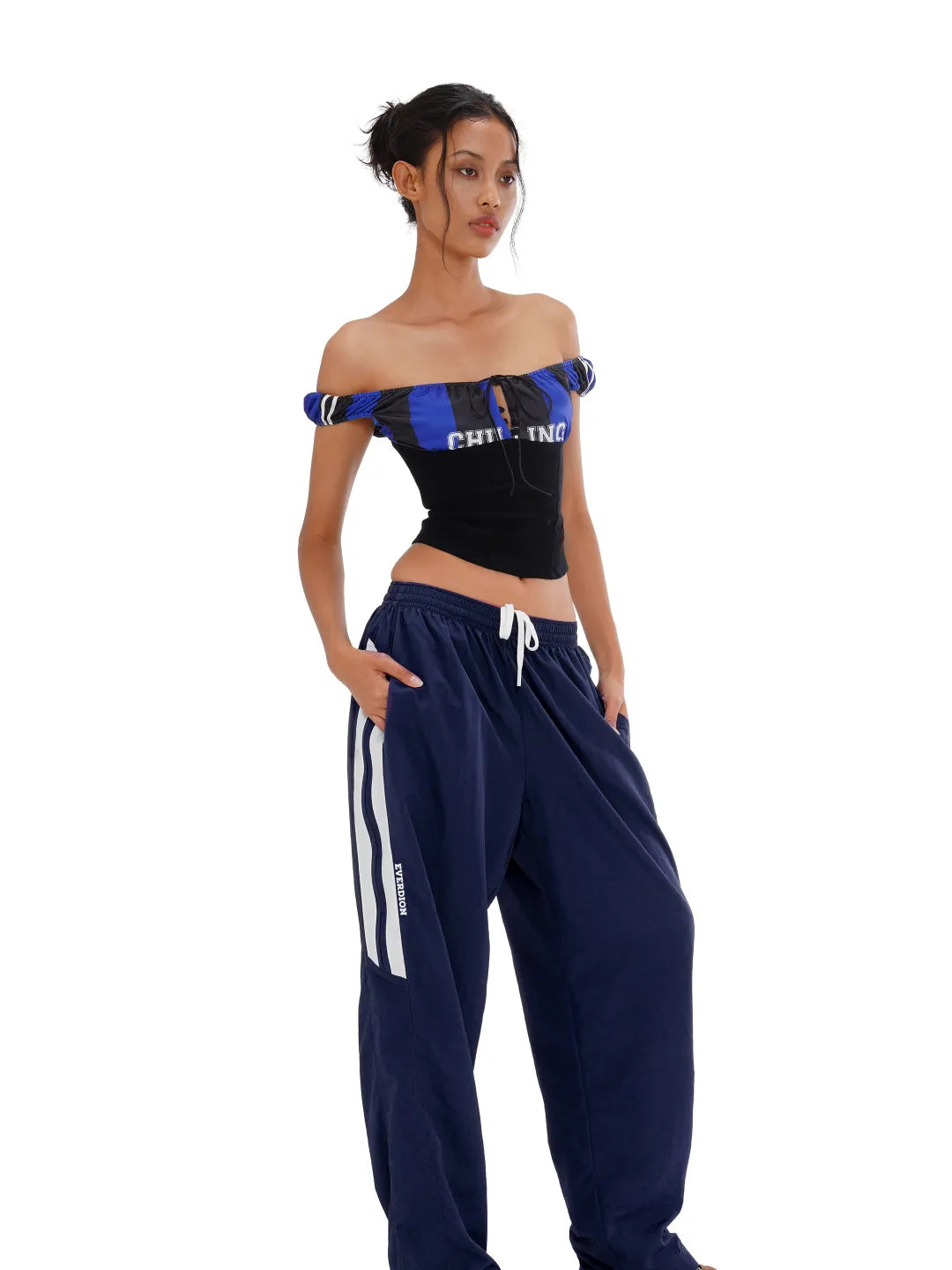 Navy blue sweatpants with white stripes on a white background