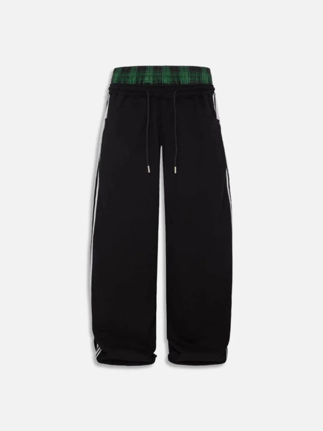 Black pants with green plaid waistband on a white background