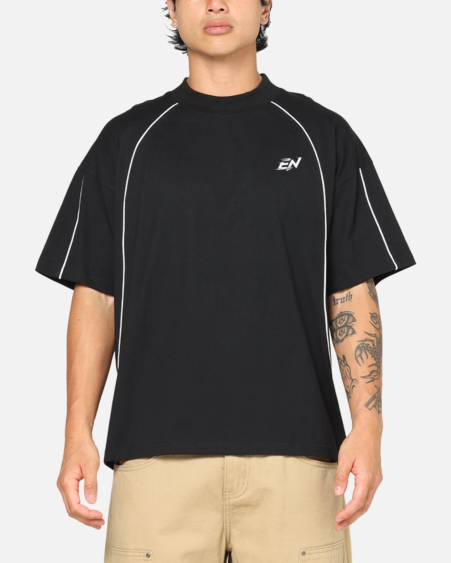 Person wearing a black t-shirt with a logo on a white background