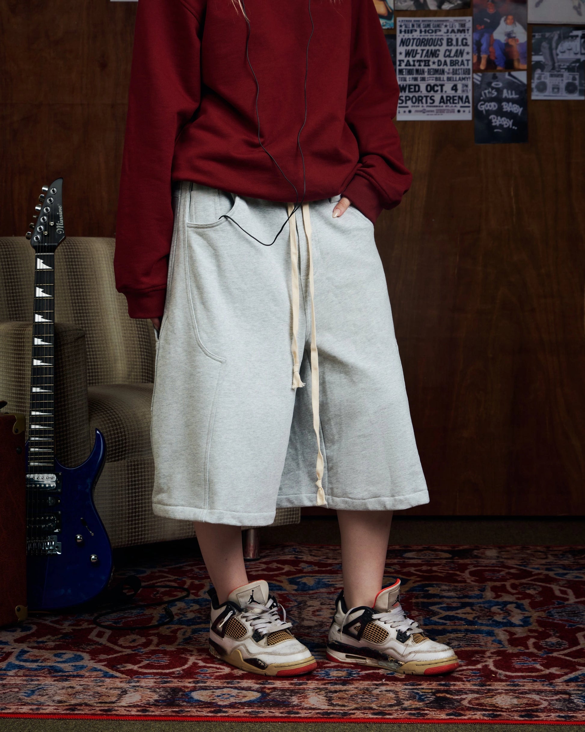 Oversized grey carpenter shorts with elastic drawstring waist and wide-leg fit