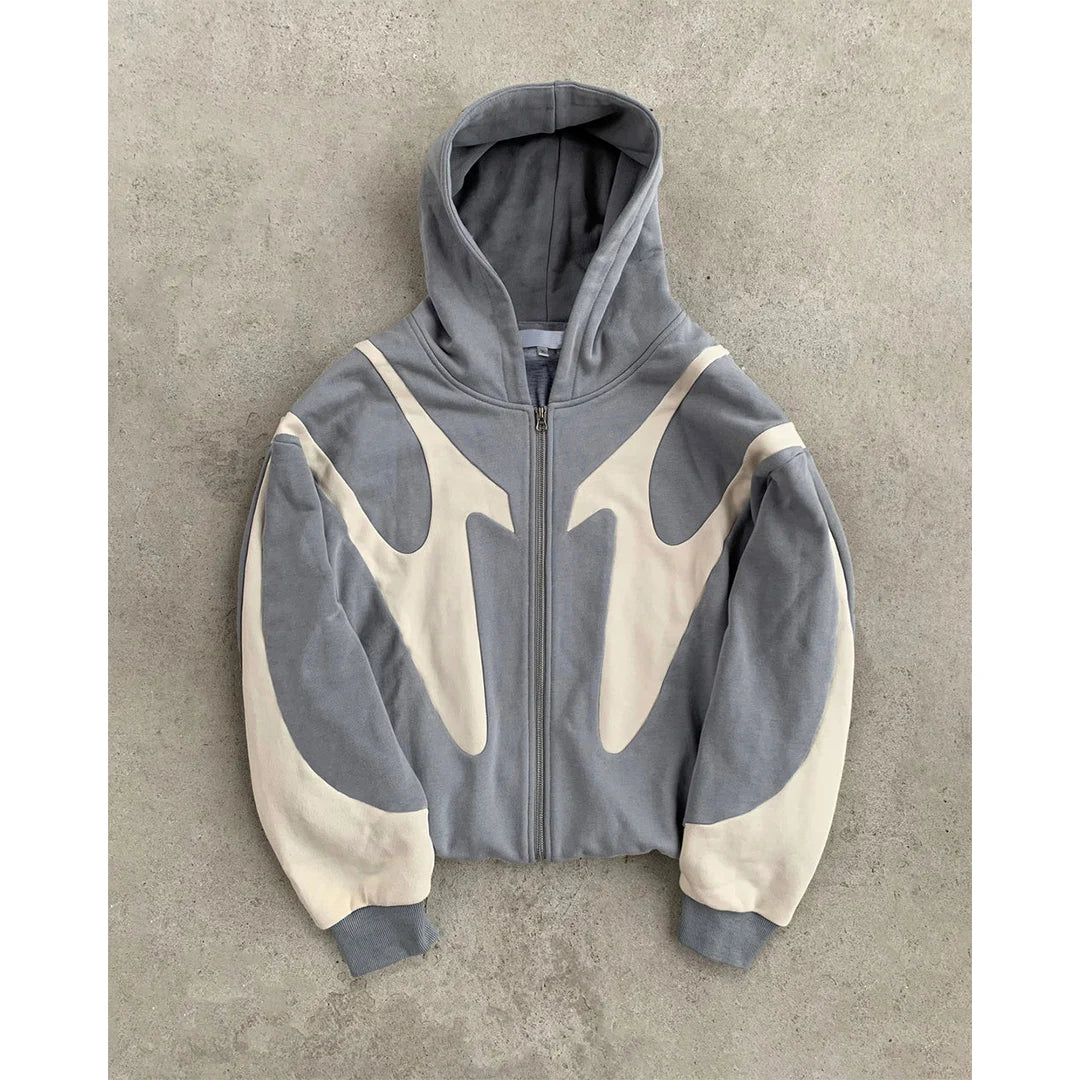 Gray and beige hoodie on a textured gray background