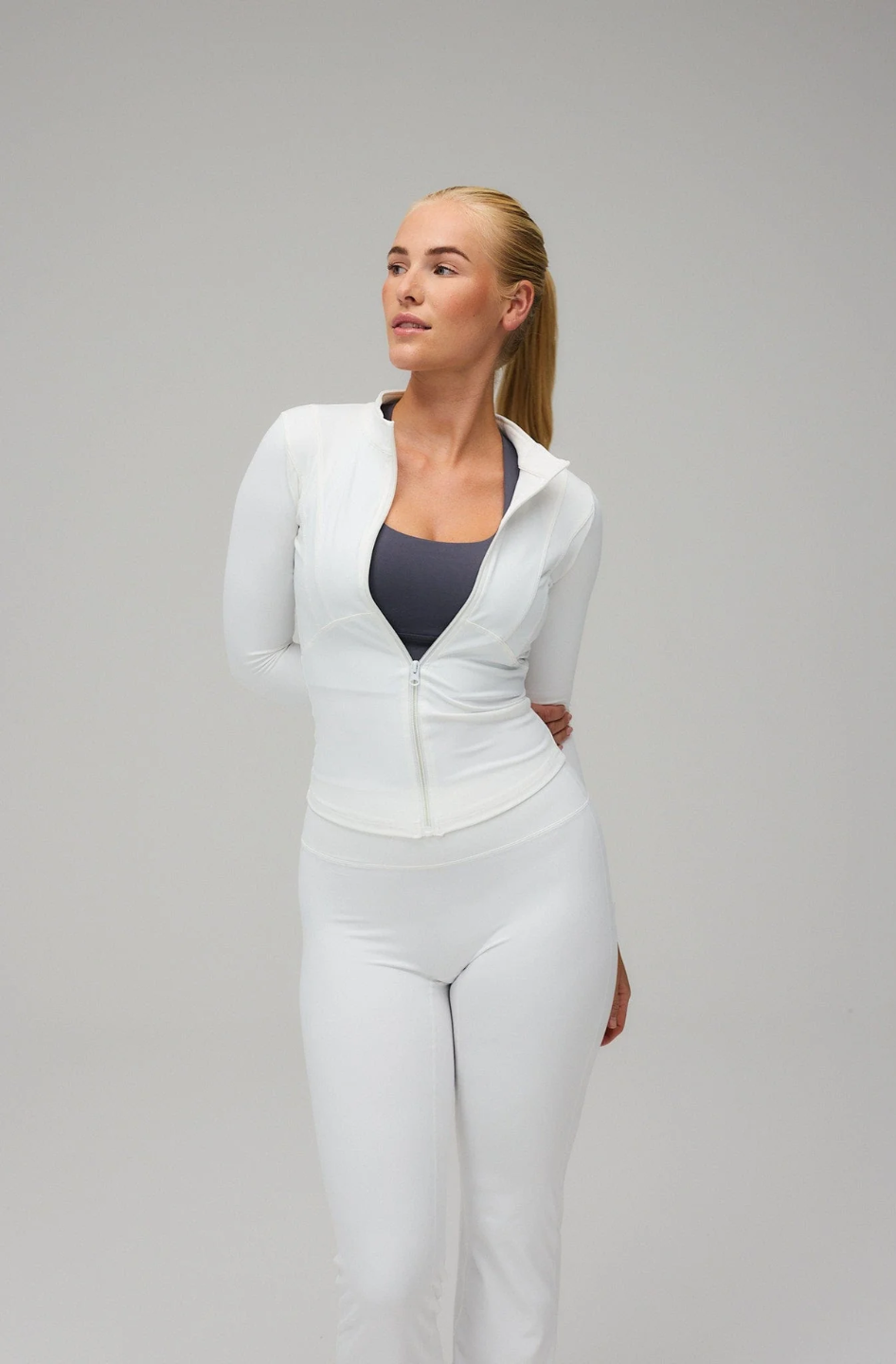 White Hyper Zip Jacket with full sleeves, featuring a front zipper and a round neckline.
