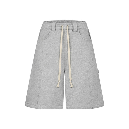 Oversized grey carpenter shorts with elastic drawstring waist and wide-leg fit