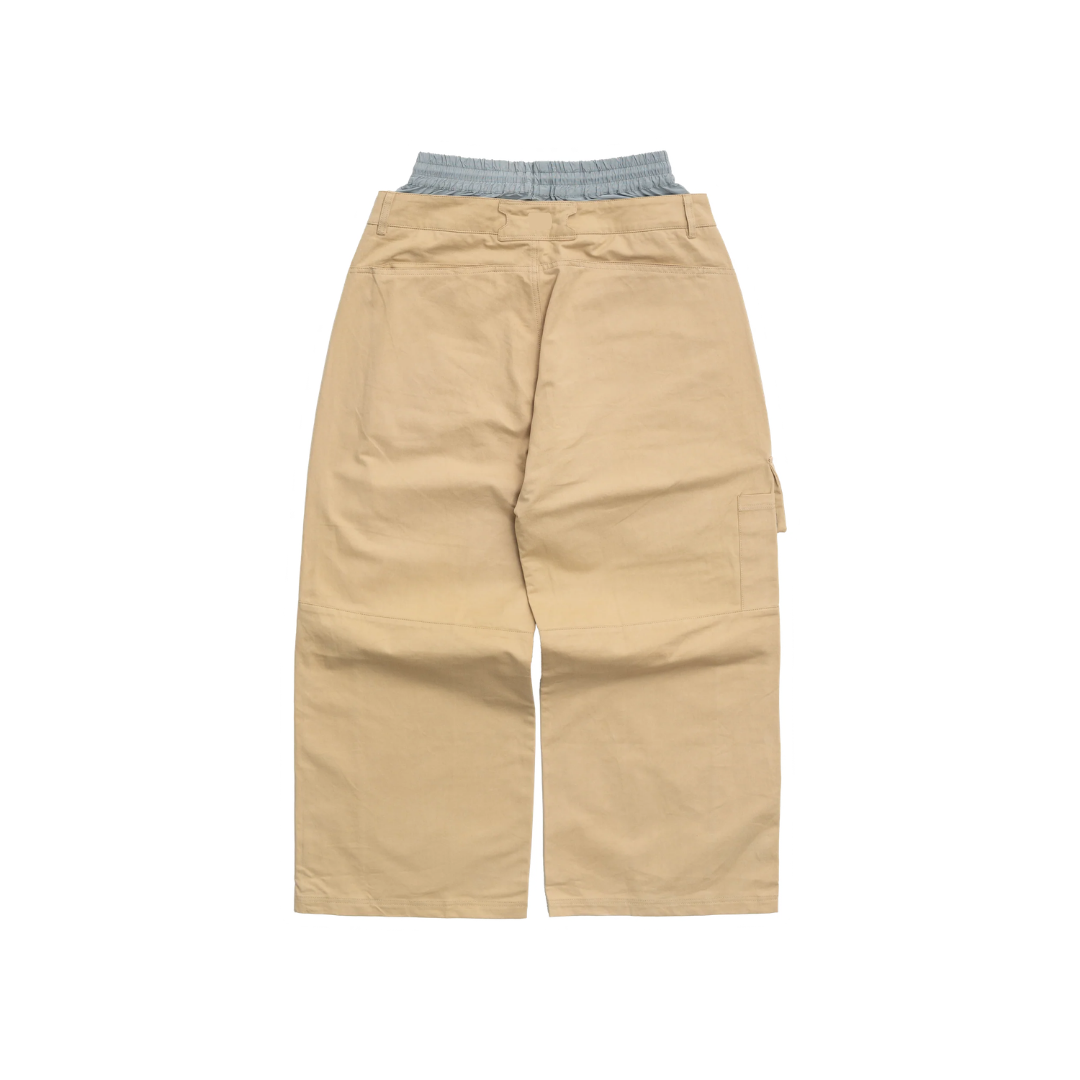 Beige cargo pants with a grey waistband on a white background