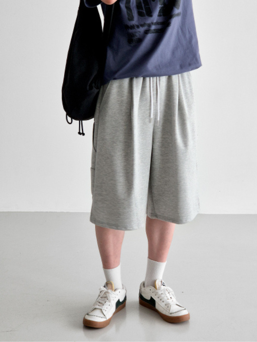 gray carpenter shorts with an elastic waistband and drawstring