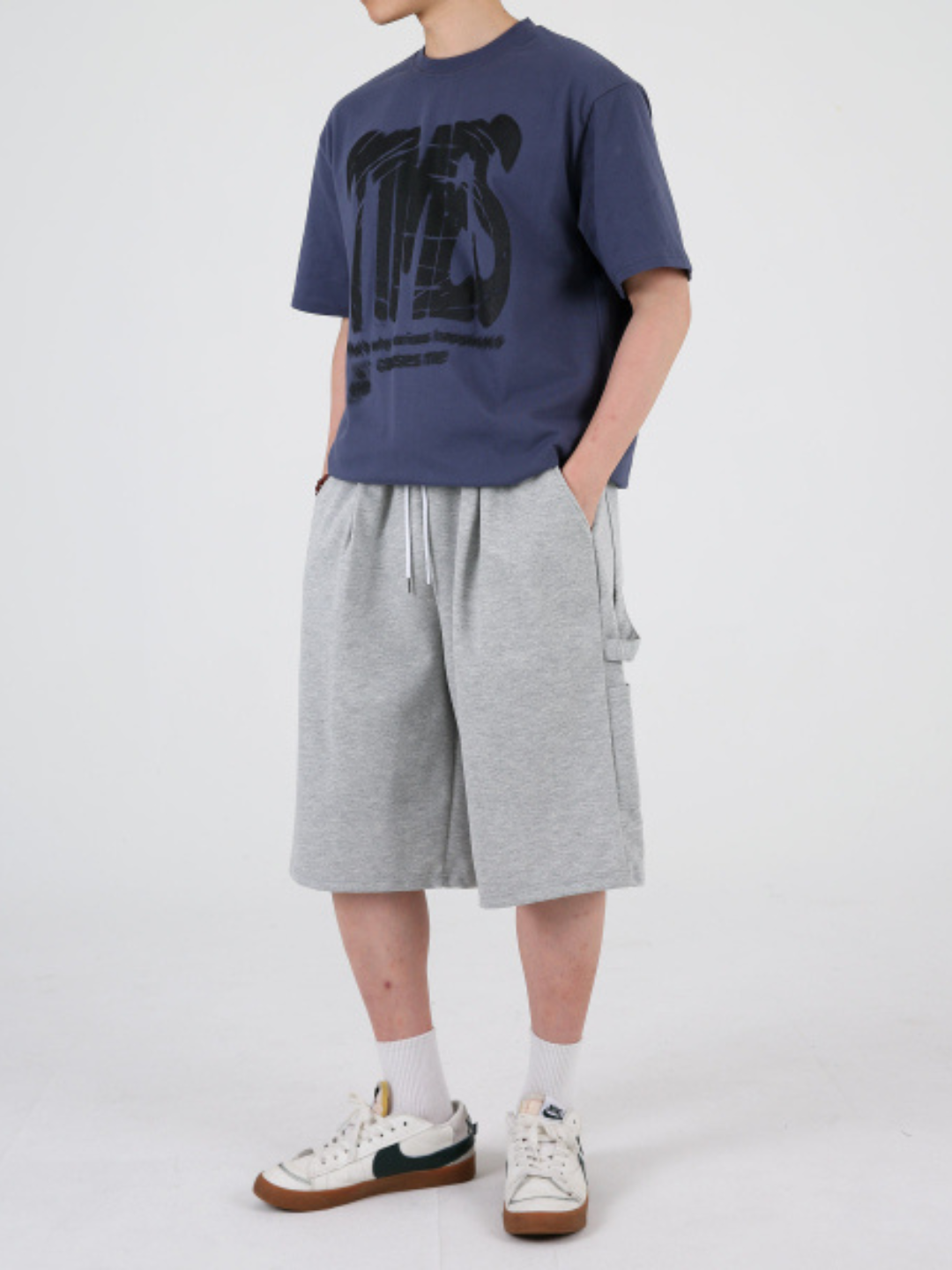 gray carpenter shorts with an elastic waistband and drawstring