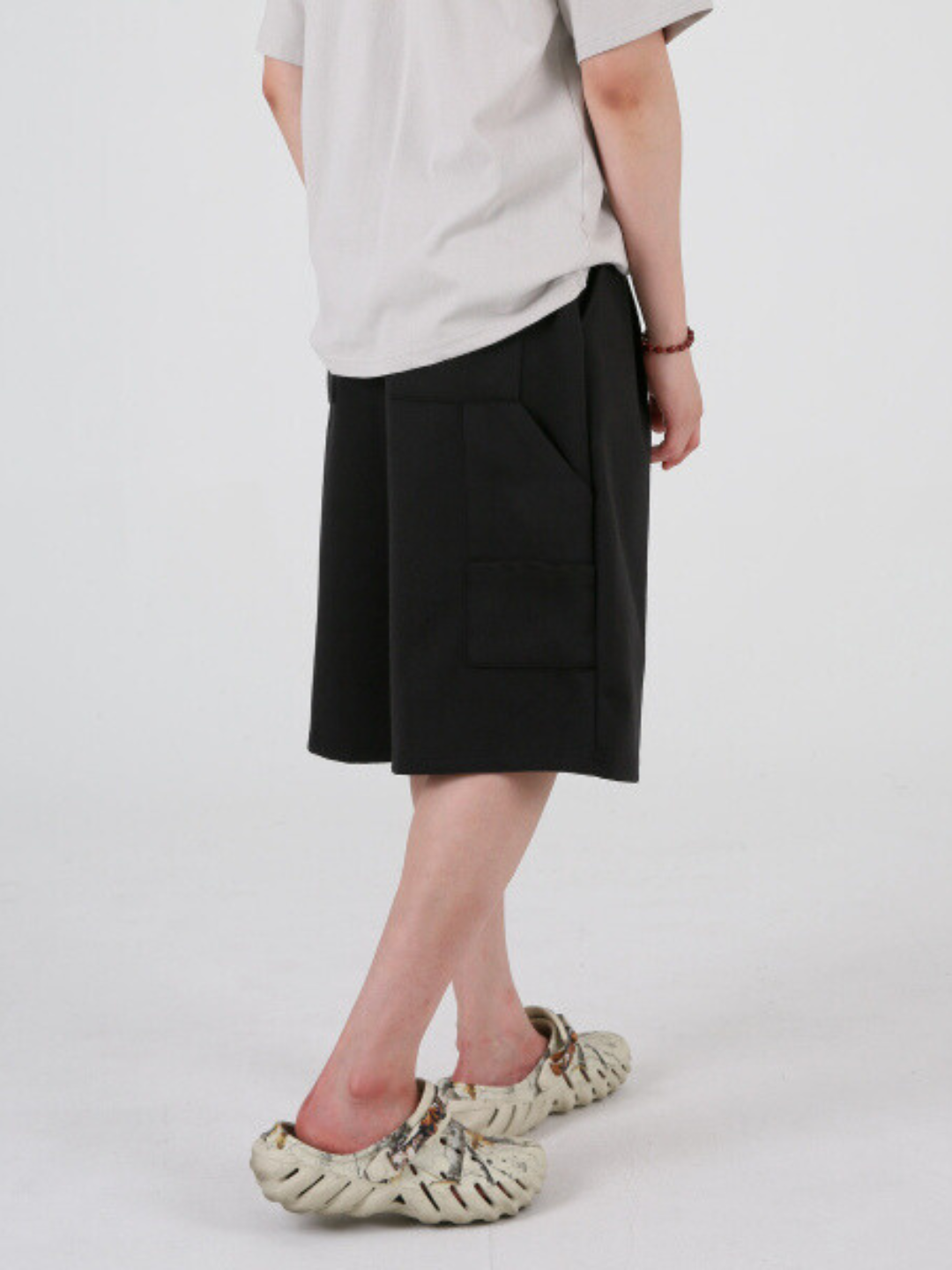 gray carpenter shorts with an elastic waistband and drawstring